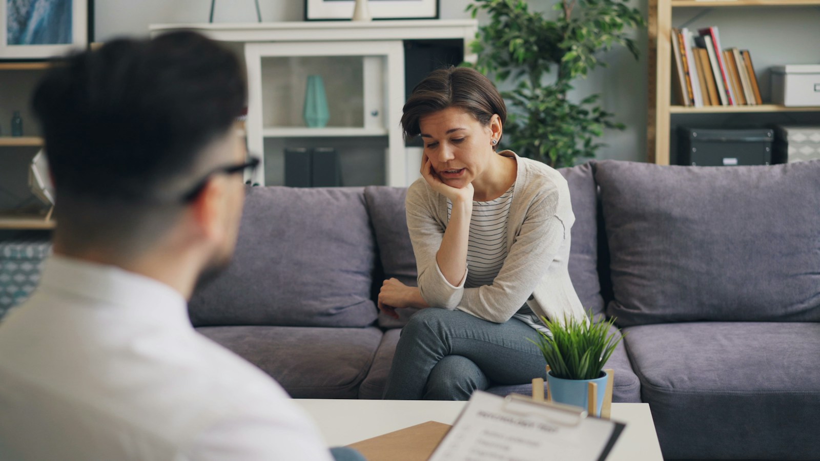 a woman sitting on a cobest rehab centers in washingtonuch talking to a man
